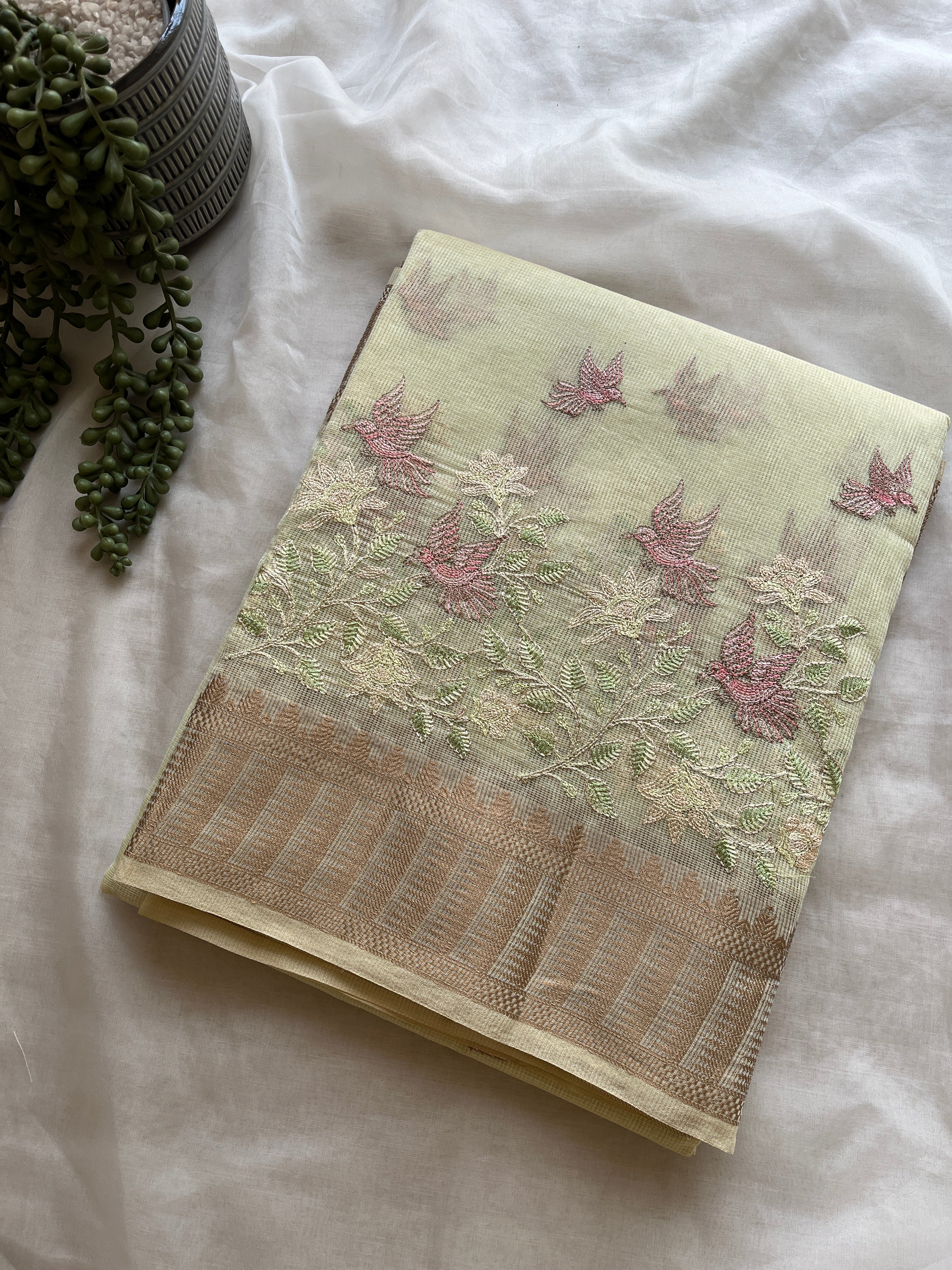 Pastel green  linen blend embroidered saree