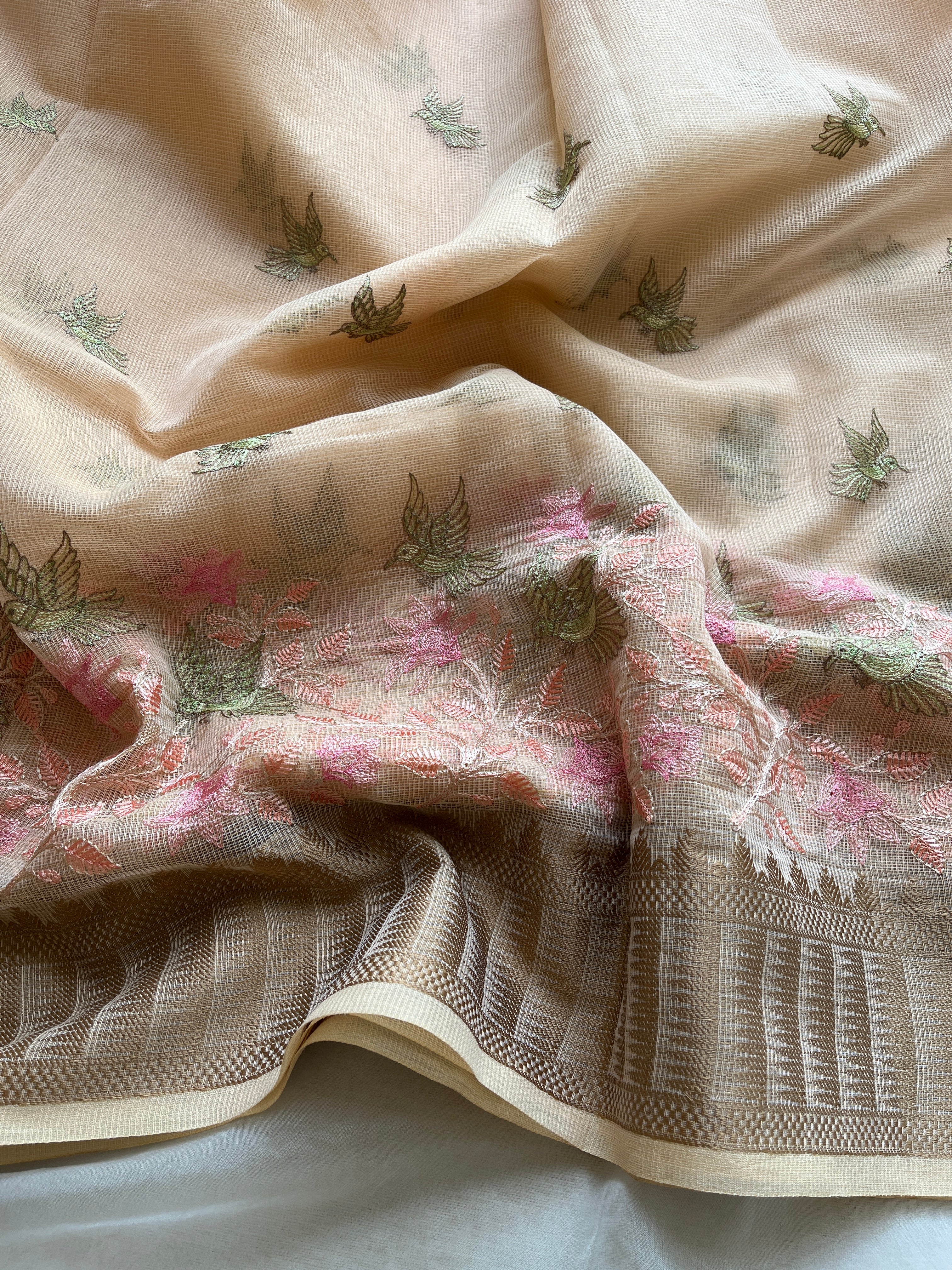 Peach linen blend embroidered saree