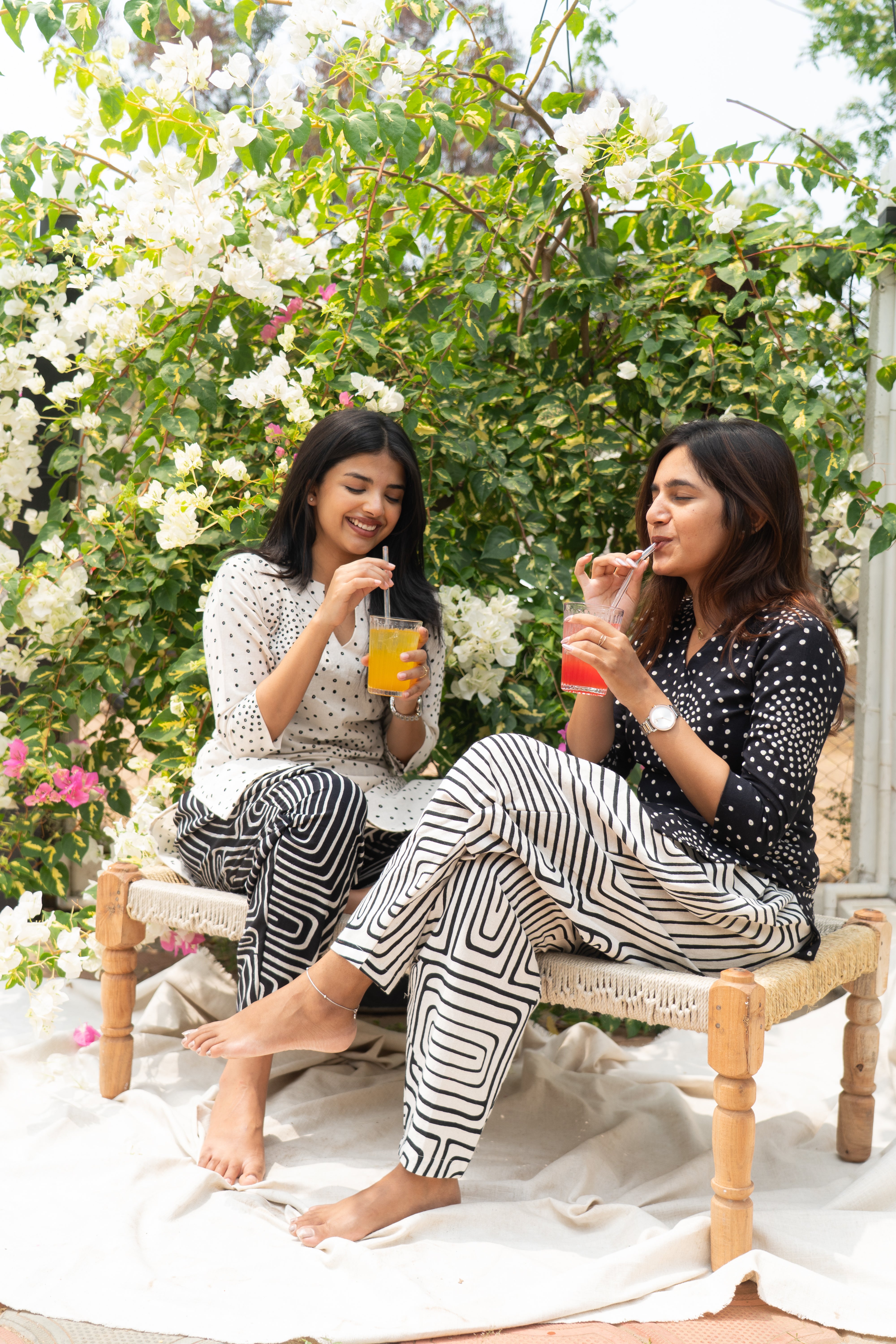 White polka short top with black pattern trousers